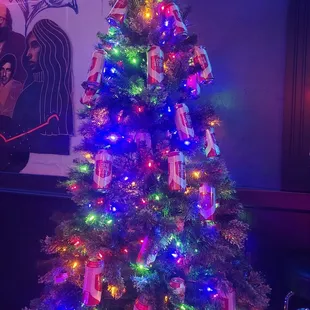 a brightly lit christmas tree in a restaurant