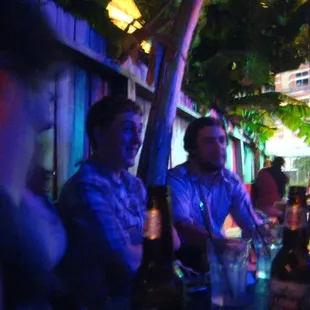 two men sitting at a table in a restaurant