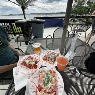 Enjoying a Sunday afternoon with some pizzas, beer, and boozy slushie...