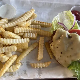 The Masterpiece Cheeseburger as a lettuce wrap with fries
