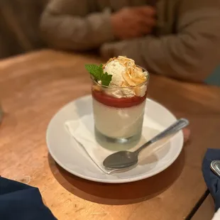 a dessert in a glass on a plate
