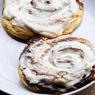 ows two cinnamon rolls on a plate