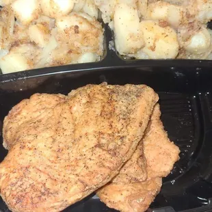 Turkey chops , fried potatoes and onions