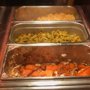 ows three pans of food