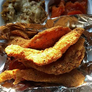 Catfish side of homemade dressing and candied yams with giblet gravy