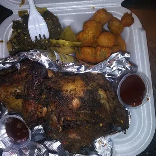 Half a jerk chicken fried okra and greens and cabbage mix