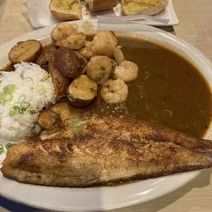 Blackened Redfish Étouffée with rice, roasted potatoes and bread