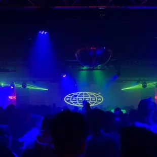 a crowd of people dancing at a nightclub