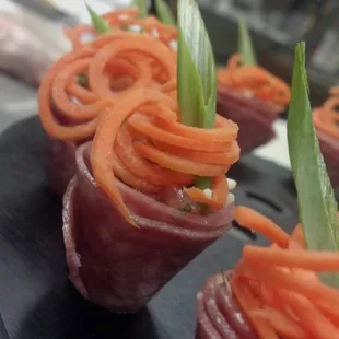 Antipasto Cones Cured Italian Meats filled with Boursin Cheese and Caprese Salad