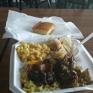 Oxtail, rice, gravy, mac n cheese, and cabbage with cornbread. So so good!!!!