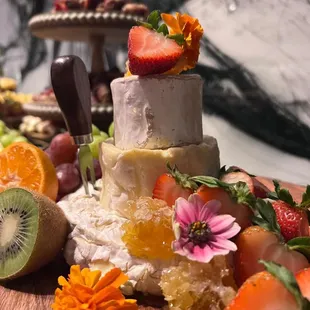Wedding cake cheese tower with honeycomb...an  unexpected addition to our charcuterie display.