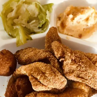 Catfish to go plates with cabbage and baked potato casserole