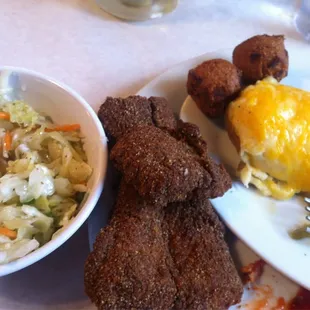 Yummy Cajun fried catfish. Comes with hush puppies and two sides. Sorry started my dinner already.