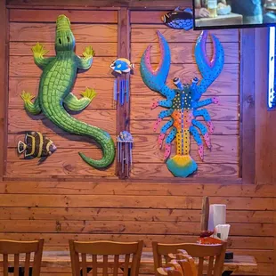 a fish and a lizard on the wall