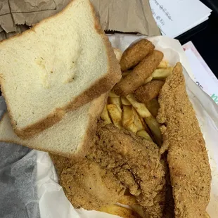 2 Catfish Fillets, Hush Puppies, bread, &amp; seasoned fries