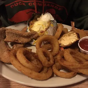 Sampler plate with cat fish, onion rings, baked potato, stuffed crab and shrimp