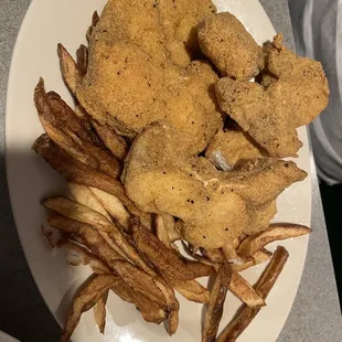 a plate of fried fish and fries