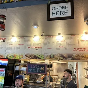 a man and a woman behind the counter