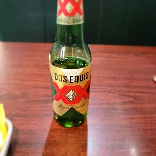 a bottle of beer on a table