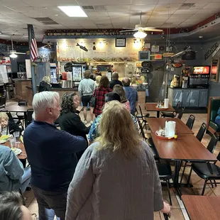 a large group of people sitting at tables