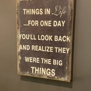 a sign that says enjoy the little things in life for one day you'll look back and realize they were the big