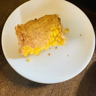 a piece of corn pie on a plate