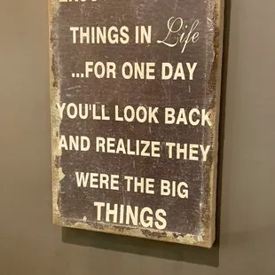a sign that says enjoy the little things in life for one day you'll look back and realize they were the big