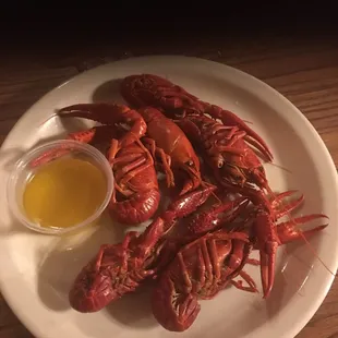 a plate of cooked lobsters