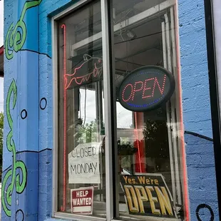 a colorful building with a sign in the window