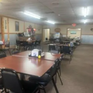a large dining room with tables and chairs