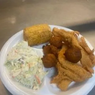 a plate of fried fish and coleslaw