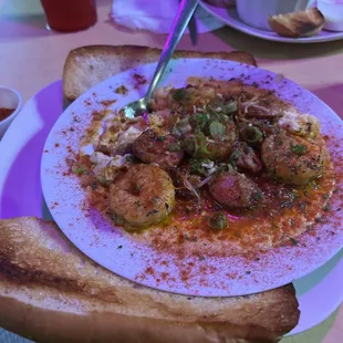 I enjoyed the shrimp and grits, it had andouille sausage the right amount of spice included two slices of bread. I recommend this meal.