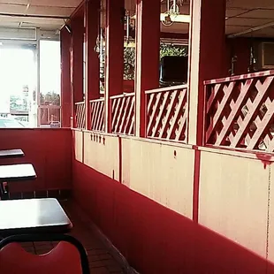 empty tables and chairs in a restaurant