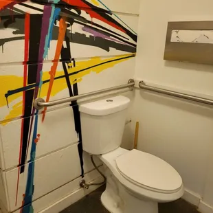 a toilet in a public restroom