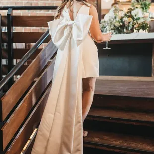 A beautiful dress on a beautiful bride as she makes her way upstairs. 

Photography by Yuriy Manchik.