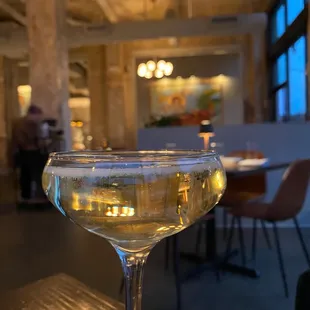 a glass of wine on a table