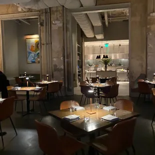 a dining room with tables and chairs