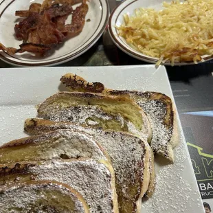 a plate of french toast and bacon