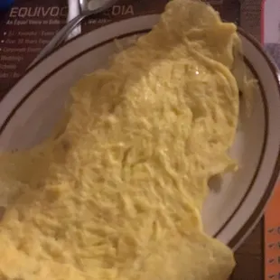 Scrambled eggs.... I cut them up and put them In a bowl of grits. I seasoned the grits with butter, salt, pepper and tobasco.