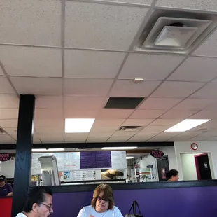 a woman and a man sitting at a table