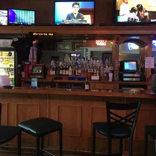 people watching tvs in a bar