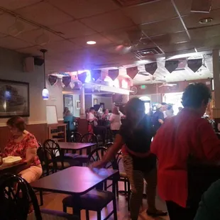 a group of people sitting at tables