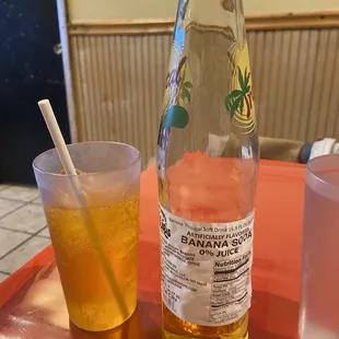 a glass of iced tea and a bottle of water