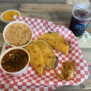 Birria Tacos with Consomé and a side of rice.