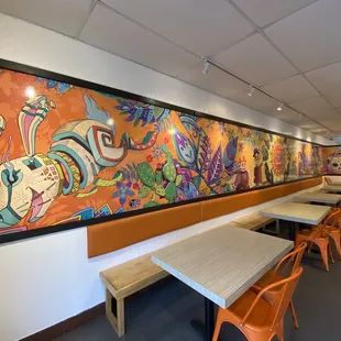 a colorful mural on the wall