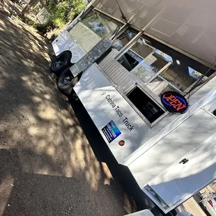 a catrina taco truck parked on the side of the road