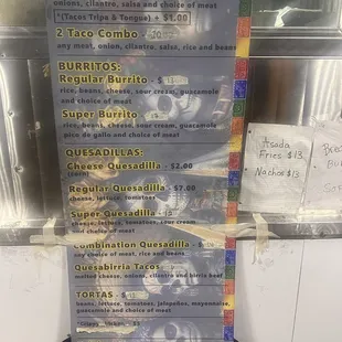 Updated prices hand written on the tape