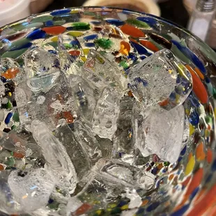 A drink, nachos, and tostada