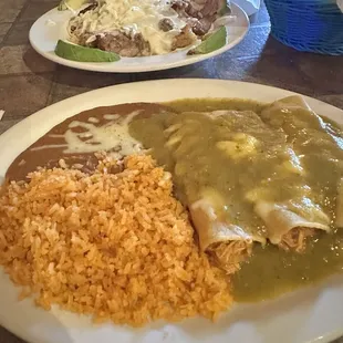 Chicken enchiladas verdes with rice and beans