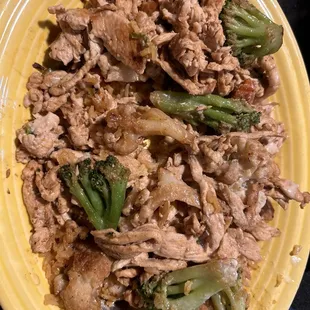 California grilled chicken on a bed of Spanish rice with veggies and cheese sauce